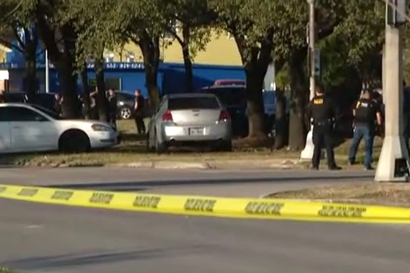 Police investigate the scene of a shooting involving three Houston police officers Thursday. (KPRC)