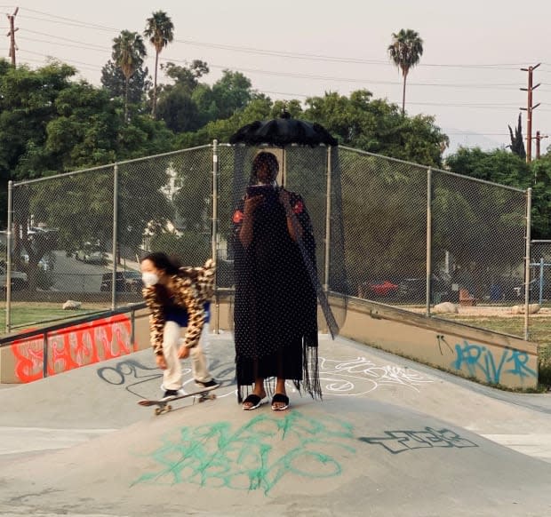 An opera singer and skateboarder at Imitation of Christ's Los Angeles show.