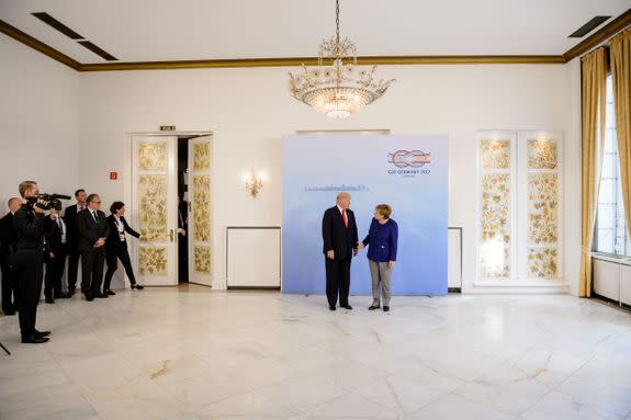 HAMBURG, GERMANY - JULY 06: German Chancellor Angela Merkel receives U.S. President Donald Trump in the Hotel Atlantic, on the eve of the G20 summit, for bilateral talks on July 6, 2017 in Hamburg, Germany. Leaders of the G20 group of nations are meeting for the July 7-8 summit. Topics high on the agenda for the summit include climate policy and development programs for African economies.  (Photo by Jens Schluter - Pool/Getty Images)