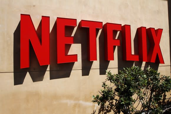 A red Netflix logo on a wall outside the company's headquarters in Los Gatos, California.