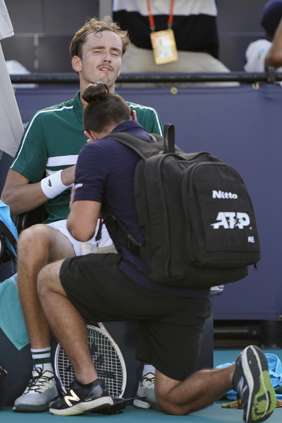 Daniil Medvedev, of Russia, receives medical attention in a break in a tennis match against Alexei Popyrin, of Australia, in the Miami Open tennis tournament, Sunday, March 28, 2021, in Miami Gardens, Fla. (AP Photo/Wilfredo Lee)