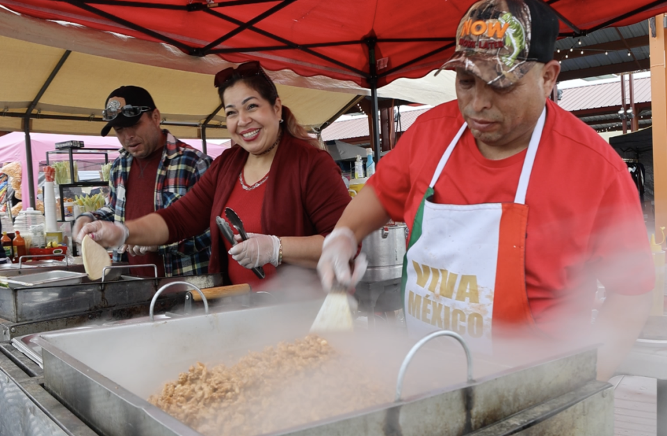 Staff at Tres Hermanos Tacos prepares meat filling and tortillas at Pasco’s Cinco de Mayo on Saturday, May 4.