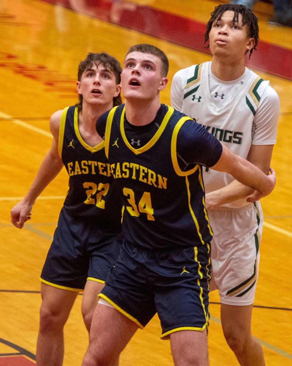 Eastern York's Simon Lipsius (22) and Carter Wamsley (24) box out against Central Catholic's David Fridia in their PIAA Class 4A quarterfinal on Friday, March 17, 2023.