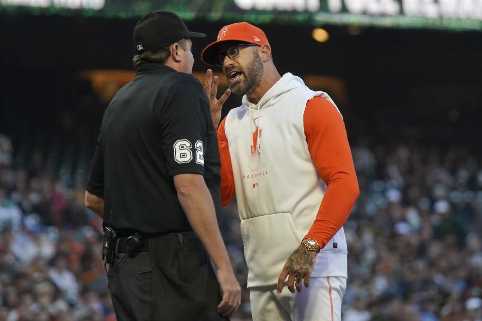 San Francisco Giants manager Gabe Kapler, right, gestures toward home plate umpire Chad Whitson after being ejected by Whitson during the fourth inning of a baseball game between the Giants and the Tampa Bay Rays in San Francisco, Tuesday, Aug. 15, 2023. (AP Photo/Jeff Chiu)