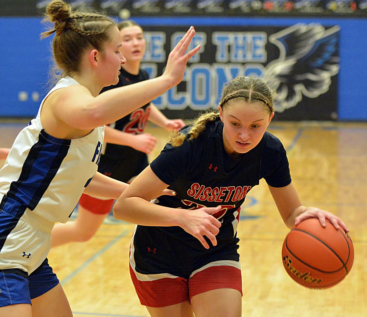 Sisseton's Emmalee Nielsen is guarded by Florence-Henry's Reese Schmidt during their high school girls basketball game on Thursday, Feb. 15, 2024 in Florence. Sisseton won 62-54.