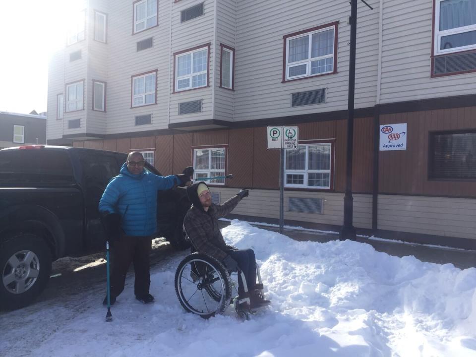 Darryl Tait and Ramesh Ferris see accessible parking spots filled with snow just like this one all over Whitehorse throughout the winter. 