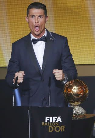 Real Madrid's Cristiano Ronaldo of Portugal, makes a speech after winning the 2014 FIFA World Player of the Year during the FIFA Ballon d'Or 2014 soccer awards ceremony at the Kongresshaus in Zurich January 12, 2015. REUTERS/Ruben Sprich