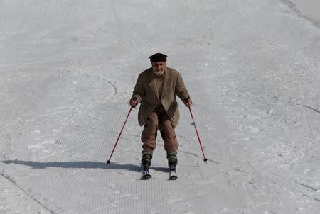 Retired Malam Jabba engineer Akbar Ali skis down the piste at the ski resort in Malam Jabba, Pakistan February 7, 2017. REUTERS/Caren Firouz/Files