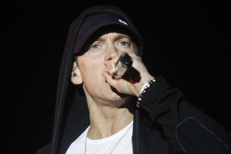 Rapper Eminem is also mentioned in the book: PA Archive/PA Images