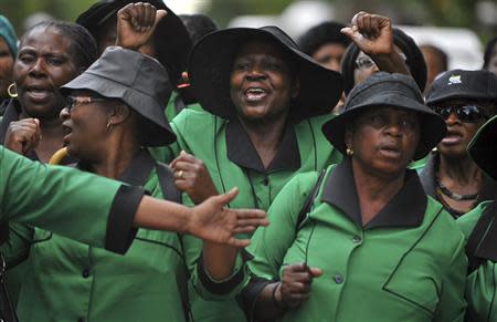 Members of the ruling African National Congress (ANC) Women's League march in Pretoria on the anniversary of the killing of Reeva Steenkamp, February 14, 2014. REUTERS/Stringer