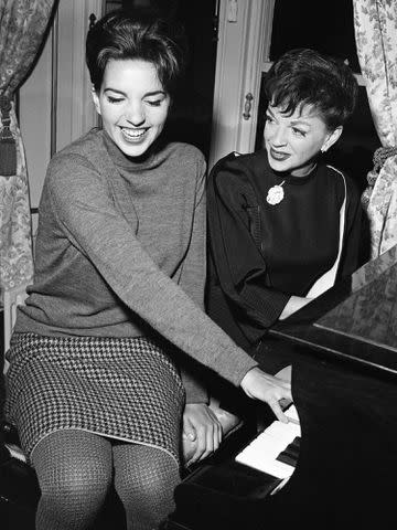 <p>Staff/Mirrorpix/Getty</p> Judy Garland and Liza Minnelli in 1964