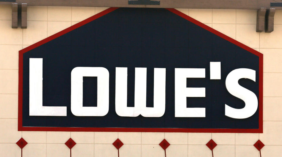 A view of the sign outside the Lowes store in Westminster, Colorado February 26, 2014. Lowe's Cos Inc reported strong growth in quarterly sales, showing that the No. 2 U.S. home improvement retailer was narrowing the gap with market leader Home Depot Inc. Lowe's shares rose more than 6 percent in early trading, after the company reported that net sales increased 5.6 percent to $11.66 billion in the fourth quarter ended January 31.  REUTERS/Rick Wilking (UNITED STATES - Tags: BUSINESS)