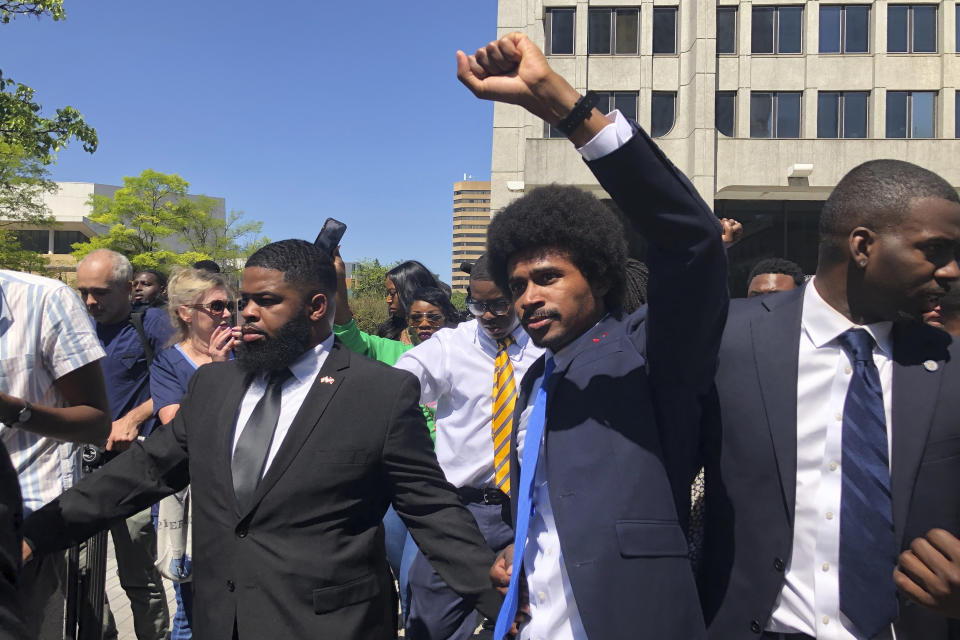 Justin Pearson celebrates with supporters after being reinstated to the the Tennessee House of Representatives by the Shelby County Board of Commissioners building in Memphis, Tenn., on Wednesday, April 12, 2023. Republicans expelled Pearson and Rep. Justin Jones last week over their role in a gun control protest on the House floor after a Nashville school shooting that left three children and three adults dead. (AP Photo/Adrian Sainz)