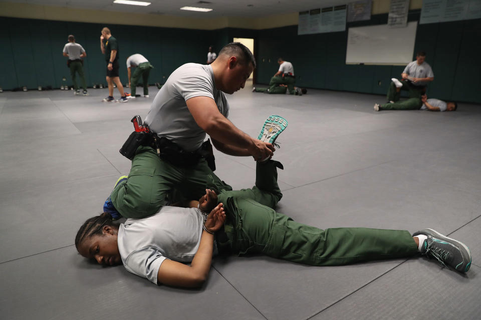 <p>New U.S. Border Patrol agents practice take-down procedures at the Border Patrol Academy on August 2, 2017 in Artesia, N.M. (Photo: John Moore/Getty Images) </p>