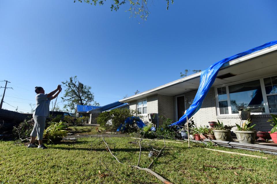 Marialisa Wyatt surveys the damage her home sustained during Hurricane Delta, only six weeks after it was battered by Laura in Lake Charles, Louisiana. Saturday. Oct. 10, 2020