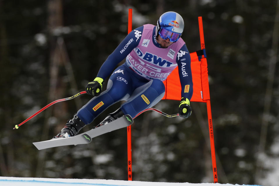 FILE - In this Dec. 7, 2019, file photo, Italy's Dominik Paris skis during a men's World Cup downhill skiing race in Beaver Creek, Colo. Paris writes his own lyrics as the lead singer of a heavy power metal band. Outside passions are a way for racers to take their minds off always thinking about racing. (AP Photo/Robert F. Bukaty, File)