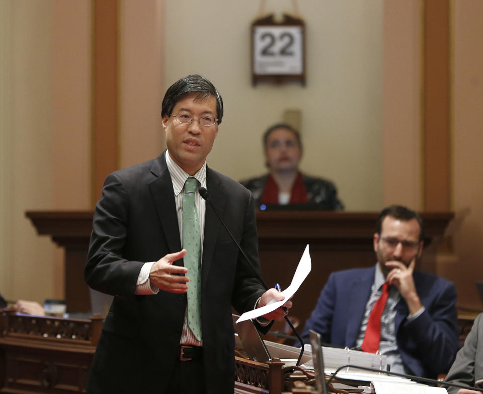 State Sen. Richard Pan, D-Sacramento, left, calls on lawmakers to approve his measure to toughen the rules for vaccination exemptions Wednesday, May 22, 2019, in Sacramento, Calif. The Senate approved the bill, SB276, that gives state public health officials instead of local doctors the power to decide which children can skip their shots before attending school. (AP Photo/Rich Pedroncelli)