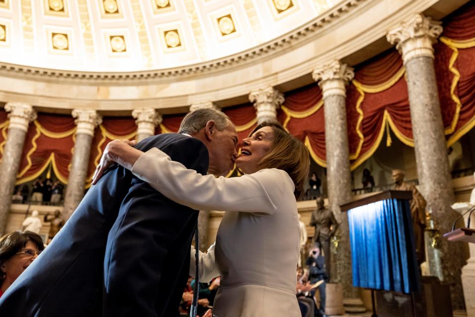 Speaker of the House Nancy Pelosi (D-CA) hugs former Speaker John Boehner of Ohio during her portrait unveiling ceremony in Statuary Hall at the U.S. Capitol on December 14, 2022 in Washington, DC.