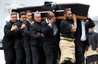 The casket of late New Zealand All Blacks rugby legend Jonah Lomu is carried after a memorial service at Eden Park in Auckland on November 30, 2015