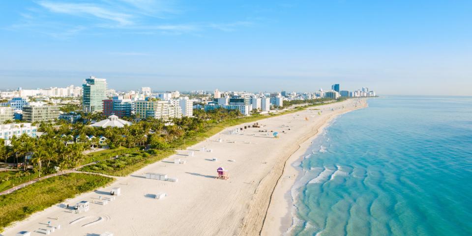 High drone panoramic view of South Beach in Miami from South Pointe Park, Florida, USA - stock photo World famous South Beach at Miami South Pointe Park with high skyscrapers and a blue sunny summer sky, Florida, USA. Panoramic high view of the Art Deco district close to downtown Miami in the southern spot of South Beach.