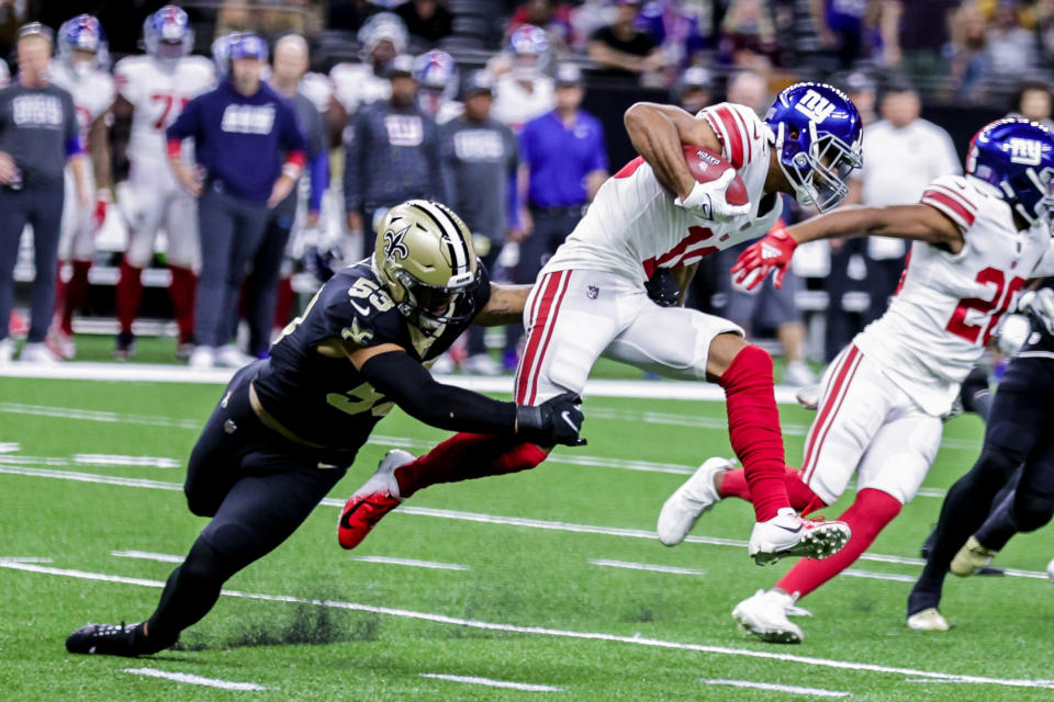 Oct 3, 2021; New Orleans, Louisiana, USA; New Orleans Saints linebacker Zack Baun (53) attempts to tackle <a class="link " href="https://sports.yahoo.com/nfl/teams/ny-giants/" data-i13n="sec:content-canvas;subsec:anchor_text;elm:context_link" data-ylk="slk:New York Giants;sec:content-canvas;subsec:anchor_text;elm:context_link;itc:0">New York Giants</a> wide receiver C.J. Board (18) during the first half at Caesars Superdome. Mandatory Credit: Stephen Lew-USA TODAY Sports