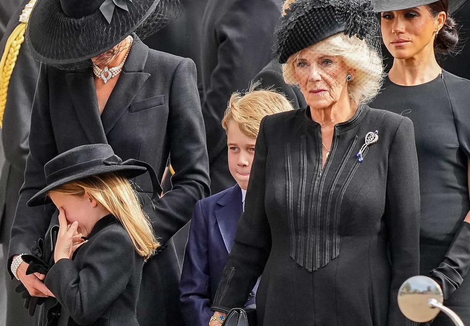 Kate, Princess of Wales, Princess Charlotte, Prince George, Camilla, the Queen Consort and Meghan, Duchess of Sussex follow the coffin of Queen Elizabeth II following her funeral service in Westminster Abbey in central London Monday Sept. 19, 2022.<span class="copyright">Martin Meissner—Pool/AP</span>