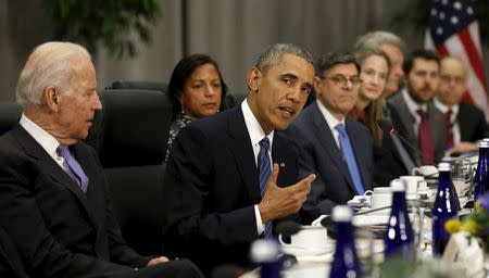 Seated with members of his delegation, U.S. President Barack Obama speaks during his meeting with Chinese President Xi Jinping at the Nuclear Security Summit in Washington March 31, 2016.REUTERS/Kevin Lamarque