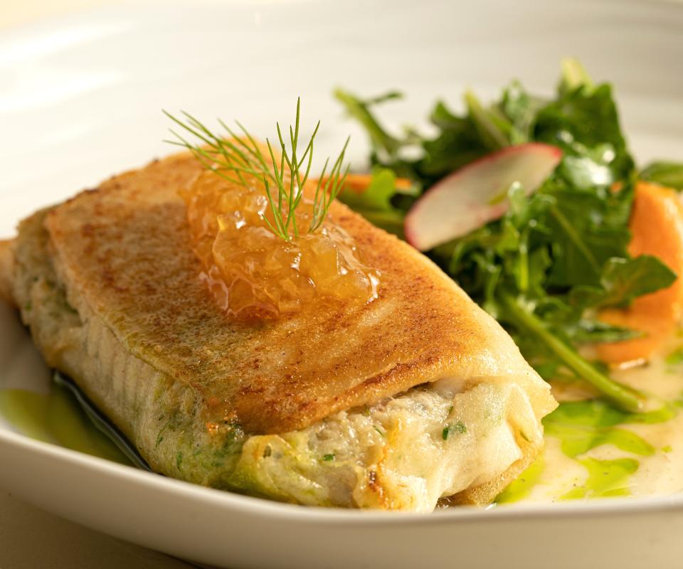 Skate comes wrapped in feuille de brick and served with a Champagne beurre blanc, lemon confit, and endive salad at Oak Park.