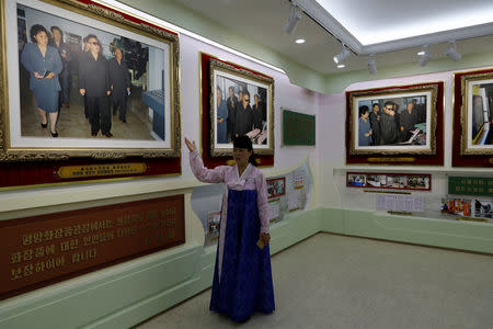 A guide gives foreign reporters a tour of an exhibition to commemorate visits by North Korean leaders Kim Jng Il and Kim Jong Un to a cosmetic factory in Pyongyang, North Korea, September 8, 2018. Picture taken September 8, 2018. REUTERS/Danish Siddiqui