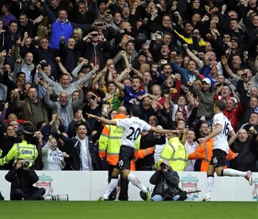 Manchester United's Robin Van Persie celebrates scoring against Liverpool during their English Premier League soccer match at Anfield in Liverpool, England, Sunday Sept. 23, 2012. (AP Photo/Clint Hughes)