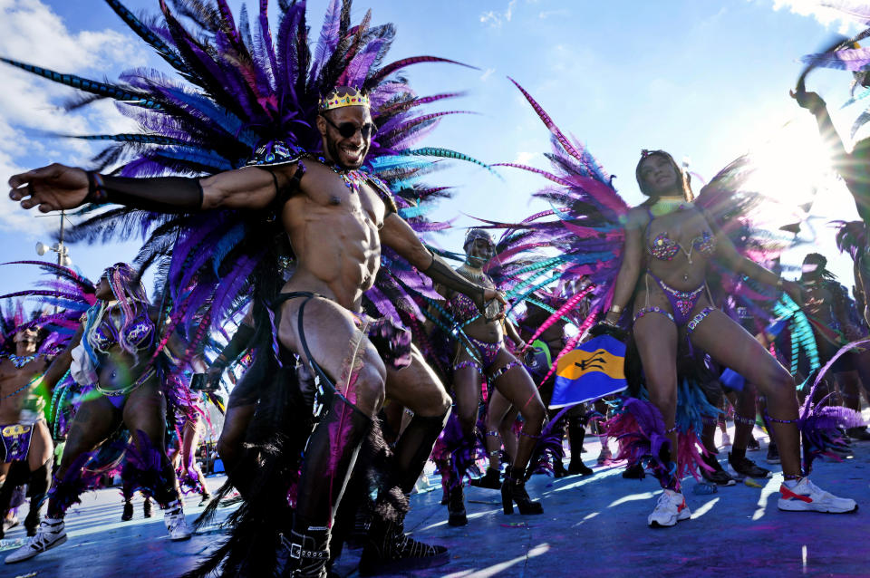 Masqueraders perform during Caribbean Carnival parade in Toronto, Canada, Saturday, July 30, 2022. The 55th annual parade returned to the streets after the COVID-19 pandemic cancelled it for two years in a row. (AP Photo/Kamran Jebreili)