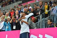 LONDON, ENGLAND - JULY 29: LeBron James #6 of the USA Mens Senior National team hugs The First Lady Michelle Obama after defeating France 98-71 at the Olympic Park Basketball Arena during the London Olympic Games on July 29, 2012 in London, England. NOTE TO USER: User expressly acknowledges and agrees that, by downloading and/or using this Photograph, user is consenting to the terms and conditions of the Getty Images License Agreement. Mandatory Copyright Notice: Copyright 2012 NBAE (Photo by Jesse D. Garrabrant/NBAE via Getty Images)