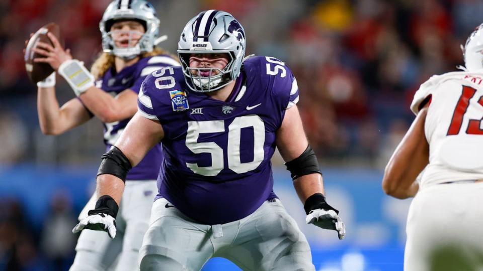 <div>ORLANDO, FL - DECEMBER 28: Kansas State Wildcats offensive lineman Cooper Beebe (50) blocks during the game between the North Carolina State Wolfpack and the Kansas State Wildcats on December 28, 2023 at Camping World Stadium in Orlando, Fl. (Photo by David Rosenblum/Icon Sportswire via Getty Images)</div>