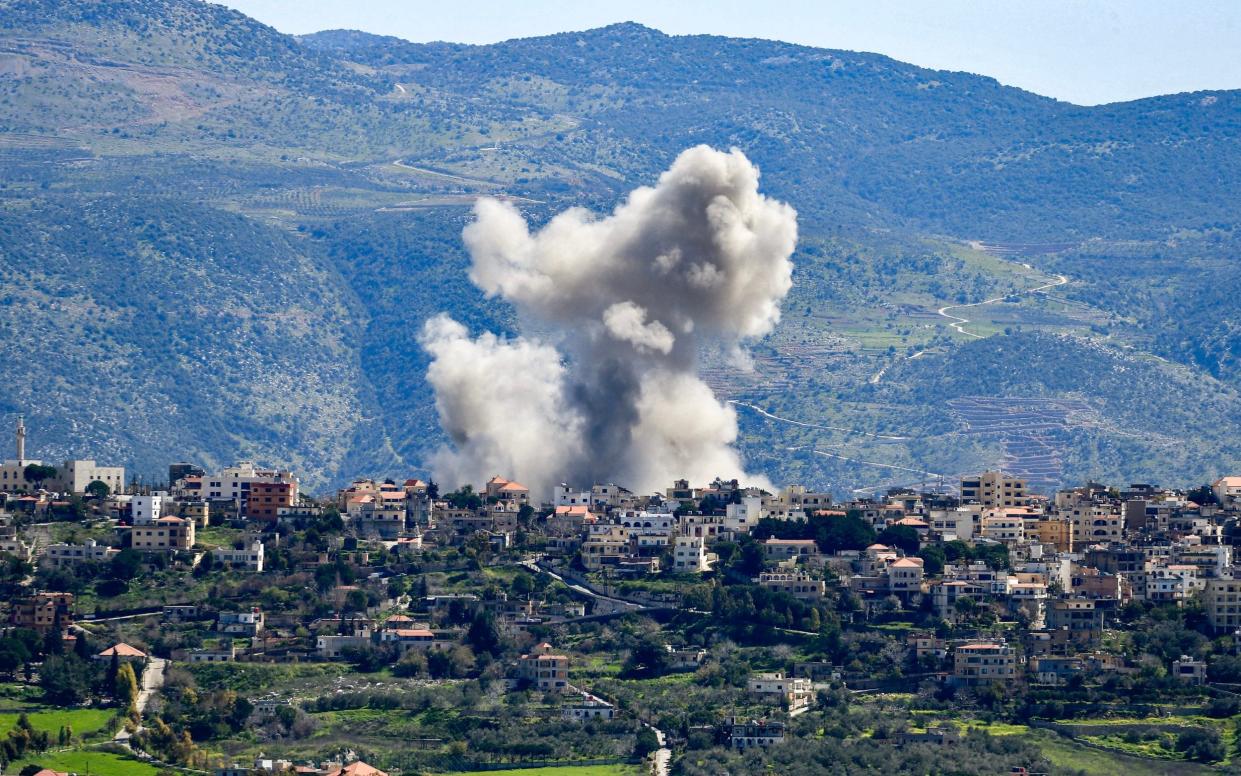 Smoke billows from the site of an Israeli airstrike that targeted the southern Lebanese village of Khiyam on March 12, 2024 amid ongoing cross-border tensions as fighting continues between Israel and Palestinian Hamas militants in the Gaza Strip.