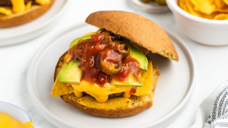 cheesy nacho burger on plate