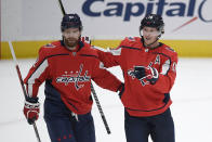 Washington Capitals center Nicklas Backstrom (19) celebrates his goal with center Evgeny Kuznetsov (92) during the first period of the team's NHL hockey game against the Philadelphia Flyers, Tuesday, April 13, 2021, in Washington. (AP Photo/Nick Wass)