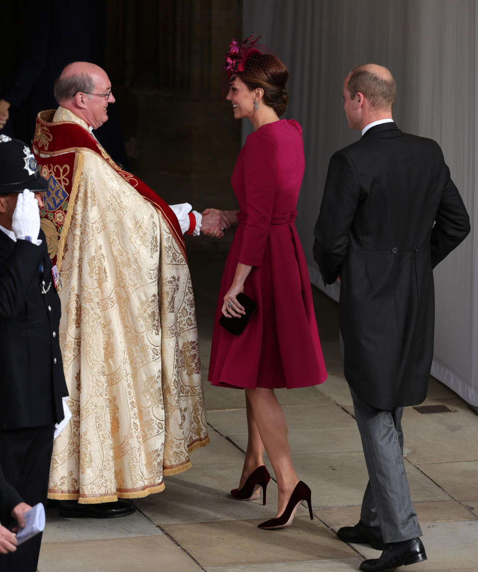 Kate chose a berry coat dress for the wedding [Photo: PA]