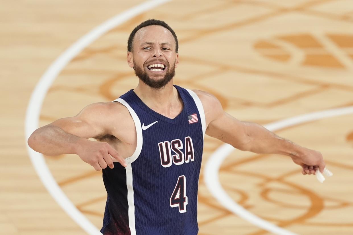 FILE - United States' Stephen Curry (4) reacts after winning a men's gold medal basketball game against France at Bercy Arena at the 2024 Summer Olympics, Aug. 10, 2024, in Paris, France. (AP Photo/Michael Conroy, File)