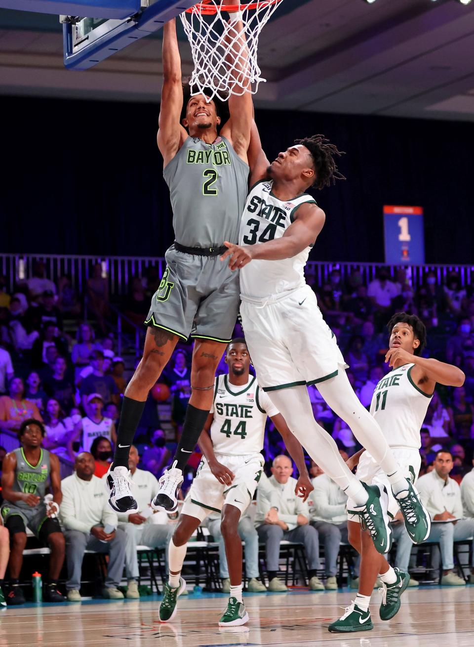 Nov 26, 2021; Nassau, BHS; Baylor Bears guard Kendall Brown (2) dunks against Michigan State Spartans forward Julius Marble II (34) during the second half at Imperial Arena.