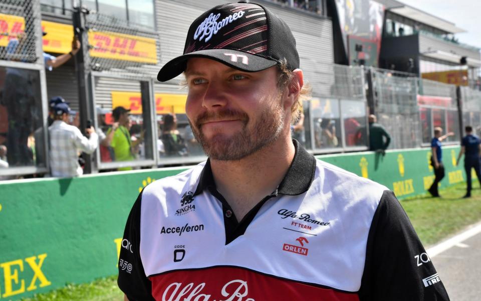 Alfa Romeo driver Valtteri Bottas of Finland walks on the track prior to the Formula One Grand Prix at the Spa-Francorchamps racetrack in Spa, Belgium, Sunday, Aug. 28, 2022 - AP