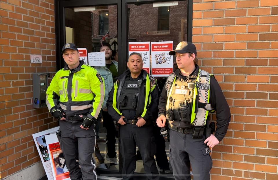 Police stand outside the venue for a Danger Cats show in Vancouver's Chinatown on March 24, 2024.