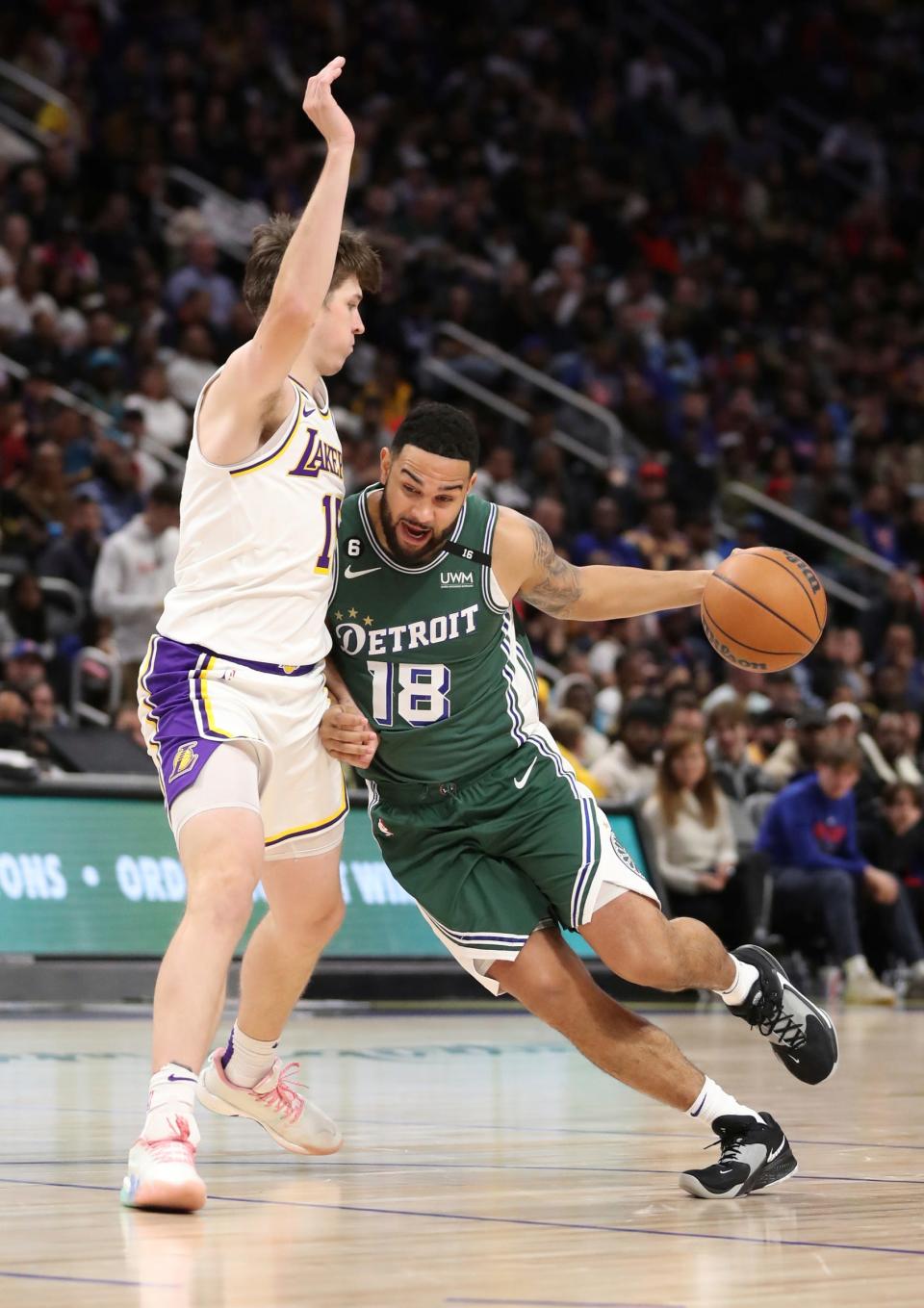 Detroit Pistons guard Cory Joseph drives against Los Angeles Lakers guard Austin Reaves during the third quarter Sunday, Dec. 11, 2022 at Little Caesars Arena.