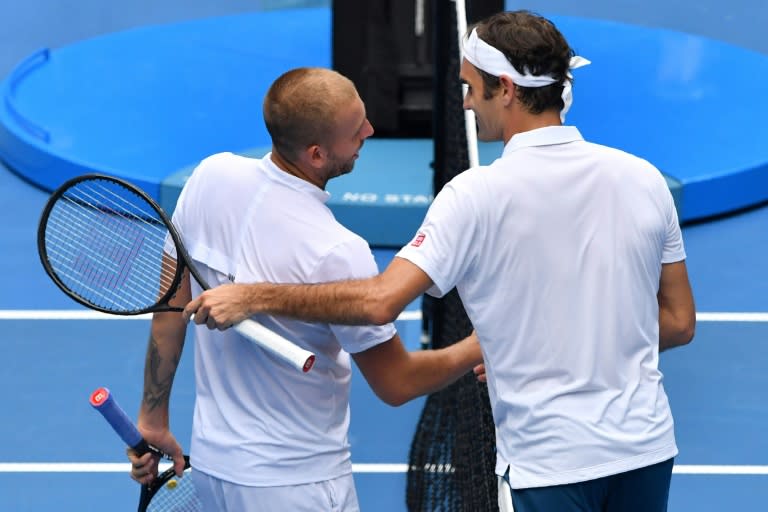 Roger Federer (R), who is gunning for a record seventh Melbourne Park title and third in a row, admitted he had been given an unusual challenge by Daniel Evans
