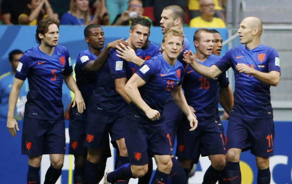 Robin van Persie of the Netherlands (C) celebrates his goal against Brazil with his teammates during their 2014 World Cup third-place playoff at the Brasilia national stadium in Brasilia July 12, 2014. REUTERS/Jorge Silva (BRAZIL - Tags: SOCCER SPORT WORLD CUP)