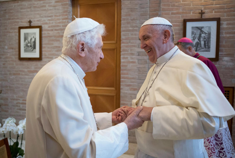 FILE - Pope Francis, right, talks with Pope Emeritus Benedict XVI in the former Convent Mater Ecclesiae at the Vatican, Saturday, Nov. 19, 2016. Pope Benedict XVI’s 2013 resignation sparked calls for rules and regulations for future retired popes to avoid the kind of confusion that ensued. Benedict, the German theologian who will be remembered as the first pope in 600 years to resign, has died, the Vatican announced Saturday Dec. 31, 2022. He was 95. (L'Osservatore Romano/Pool photo via AP, File)