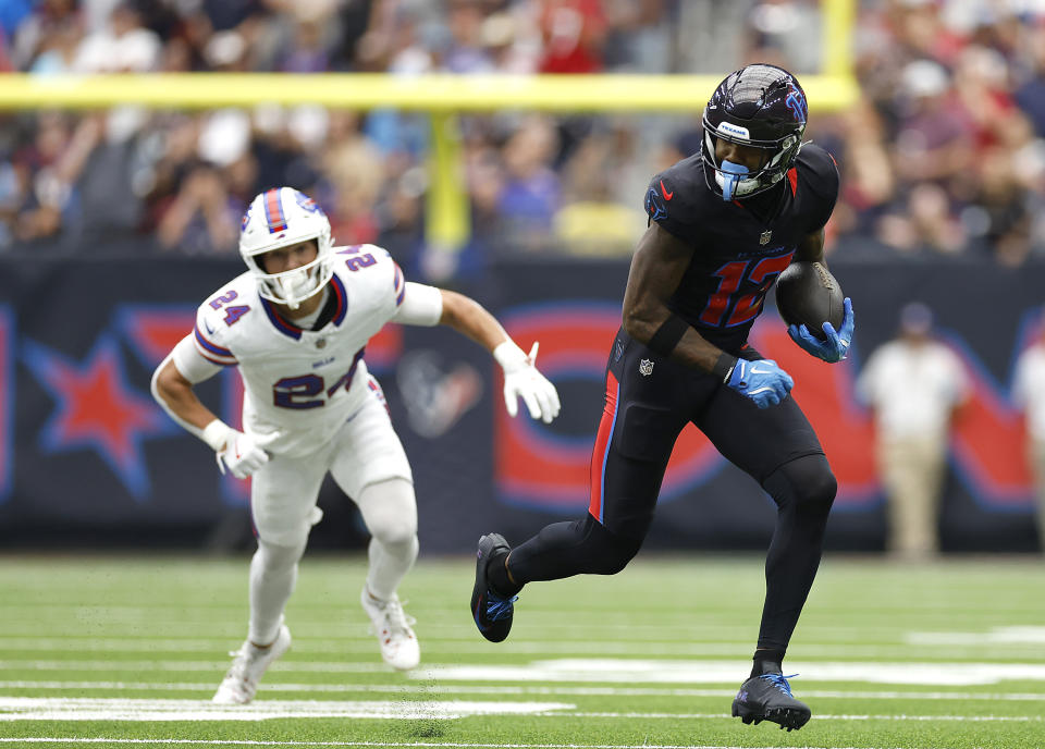 Nico Collins caught a 67-yard touchdown pass before leaving Sunday's game with a hamstring injury.  (Tim Warner/Getty Images)