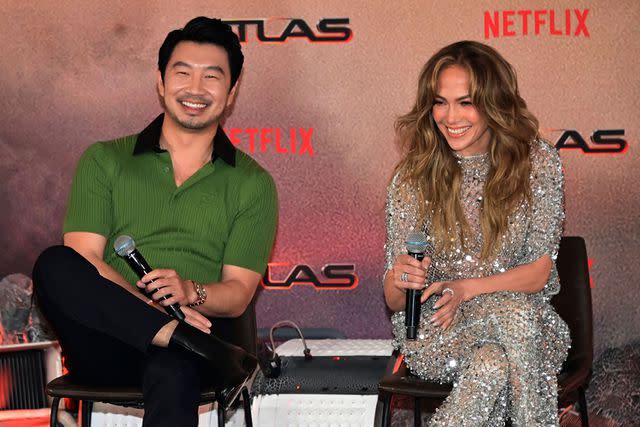 <p>Carlos Tischler/Eyepix Group/Shutterstock </p> Simu Liu and Jennifer Lopez attend 'Atlas' press conference in Mexico City.