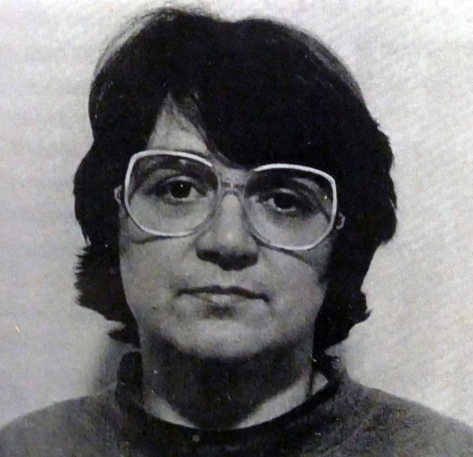 Rosemary mug shot with short brown hair and glasses