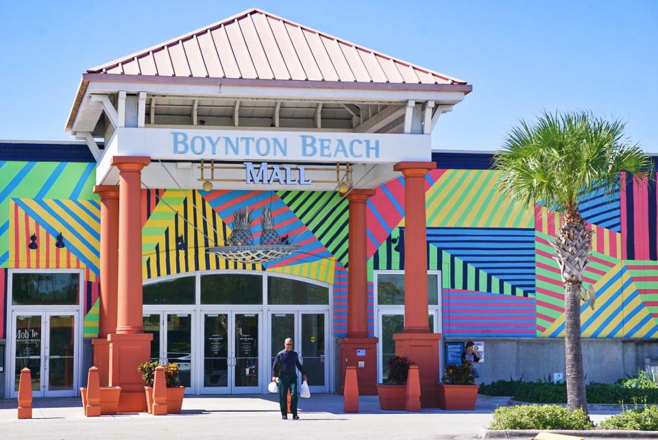 The east entrance at the Boynton Beach Mall, leading into the food court, features a colorful mural painted by Coastal Creative Concepts.