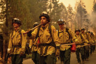 Cal Fire firefighters battle the Dixie Fire near Prattville in Plumas County, Calif., on Friday, July 23, 2021. (AP Photo/Noah Berger)